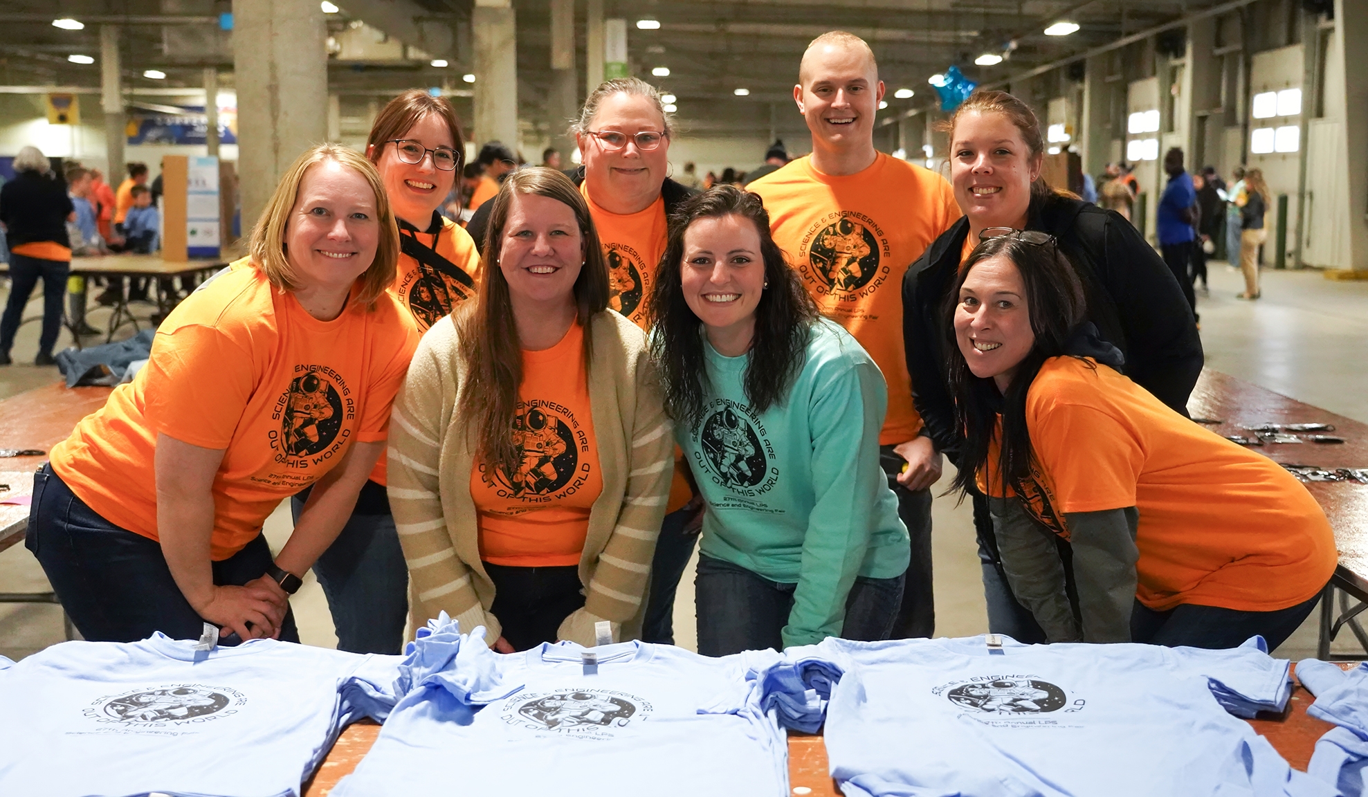 Employees volunteering at science fair